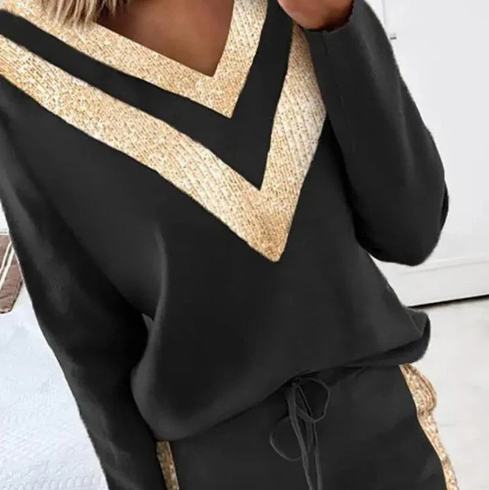 Elegante mono negro con detalles dorados para mujer - Claire
